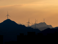 A wind power plant operates at Liangfengya in the Nanchuan district of Chongqing, China, on October 30, 2024. (