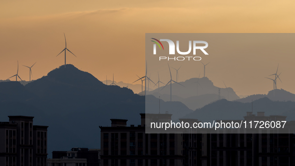 A wind power plant operates at Liangfengya in the Nanchuan district of Chongqing, China, on October 30, 2024. 