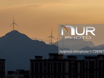 A wind power plant operates at Liangfengya in the Nanchuan district of Chongqing, China, on October 30, 2024. (