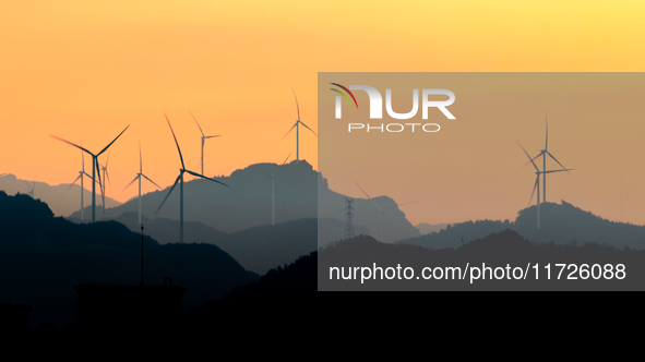 A wind power plant operates at Liangfengya in the Nanchuan district of Chongqing, China, on October 30, 2024. 