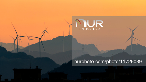 A wind power plant operates at Liangfengya in the Nanchuan district of Chongqing, China, on October 30, 2024. 