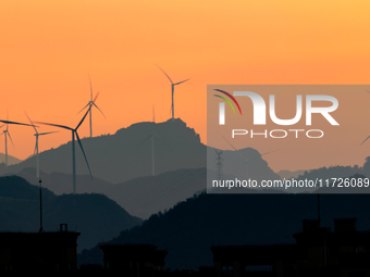 A wind power plant operates at Liangfengya in the Nanchuan district of Chongqing, China, on October 30, 2024. (