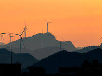 A wind power plant operates at Liangfengya in the Nanchuan district of Chongqing, China, on October 30, 2024. (