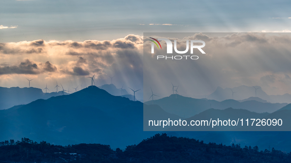 A wind power plant operates at Liangfengya in the Nanchuan district of Chongqing, China, on October 30, 2024. 