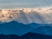 A wind power plant operates at Liangfengya in the Nanchuan district of Chongqing, China, on October 30, 2024. (