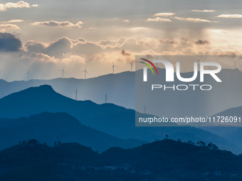 A wind power plant operates at Liangfengya in the Nanchuan district of Chongqing, China, on October 30, 2024. (