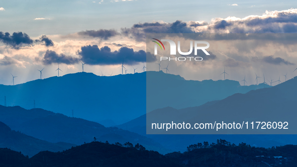 A wind power plant operates at Liangfengya in the Nanchuan district of Chongqing, China, on October 30, 2024. 