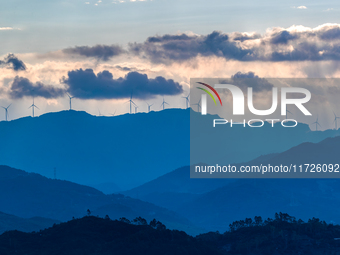 A wind power plant operates at Liangfengya in the Nanchuan district of Chongqing, China, on October 30, 2024. (