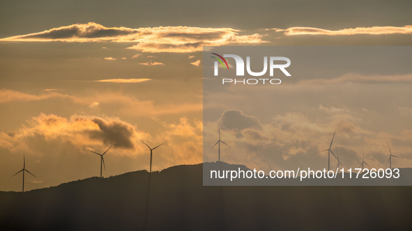 A wind power plant operates at Liangfengya in the Nanchuan district of Chongqing, China, on October 30, 2024. 