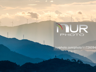 A wind power plant operates at Liangfengya in the Nanchuan district of Chongqing, China, on October 30, 2024. (