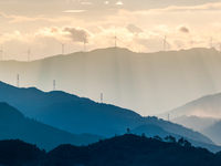 A wind power plant operates at Liangfengya in the Nanchuan district of Chongqing, China, on October 30, 2024. (