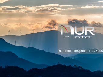 A wind power plant operates at Liangfengya in the Nanchuan district of Chongqing, China, on October 30, 2024. (