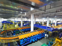 Workers use automatic sorting equipment to sort parcels at the Fuyang Mail Processing Center of China Post in Fuyang, China, on October 23,...