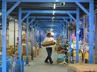 Staff sort parcels at the Fuyang distribution center of ZTO Express in Fuyang, China, on October 23, 2024. (