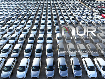 A large number of vehicles gather for loading at the terminal of Oriental Port Branch in Lianyungang Port in Lianyungang, China, on October...