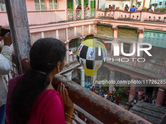 People observe lanterns being released during the Diwali festival celebration in Kolkata, India, on October 31, 2024. (