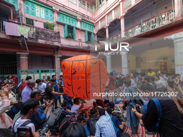 People release paper lanterns with Halloween designs during the celebration of the Diwali festival, promoting an eco-friendly celebration of...