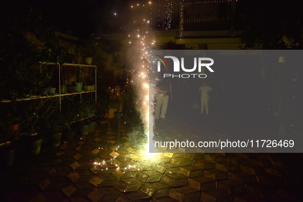 People burst firecrackers to celebrate Diwali in Nagaon District, Assam, India, on October 31, 2024. 