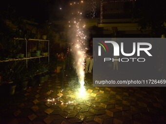 People burst firecrackers to celebrate Diwali in Nagaon District, Assam, India, on October 31, 2024. (