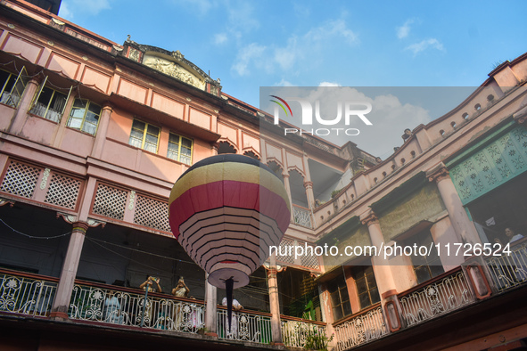 People celebrate The Fanush (a paper-made hot air balloon) festival inside an old house to mark the Diwali festival in Kolkata, India, on Oc...