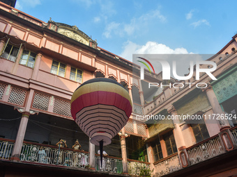 People celebrate The Fanush (a paper-made hot air balloon) festival inside an old house to mark the Diwali festival in Kolkata, India, on Oc...