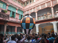 People celebrate The Fanush (a paper-made hot air balloon) festival inside an old house to mark the Diwali festival in Kolkata, India, on Oc...