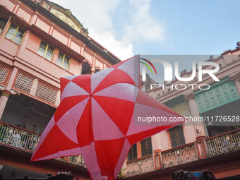 People celebrate The Fanush (a paper-made hot air balloon) festival inside an old house to mark the Diwali festival in Kolkata, India, on Oc...