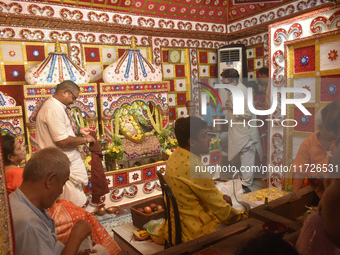 Hindu priests worship Laxmi and Ganesh idols inside a temple on the occasion of the Diwali festival in Kolkata, India, on October 31, 2024....