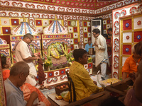 Hindu priests worship Laxmi and Ganesh idols inside a temple on the occasion of the Diwali festival in Kolkata, India, on October 31, 2024....