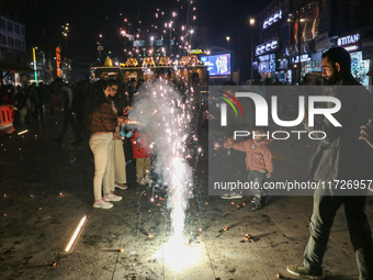 Tourists burst crackers on the day of Diwali in Srinagar, Indian Administered Kashmir, on October 31, 2024. (