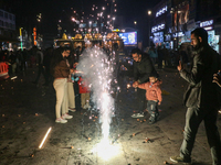 Tourists burst crackers on the day of Diwali in Srinagar, Indian Administered Kashmir, on October 31, 2024. (