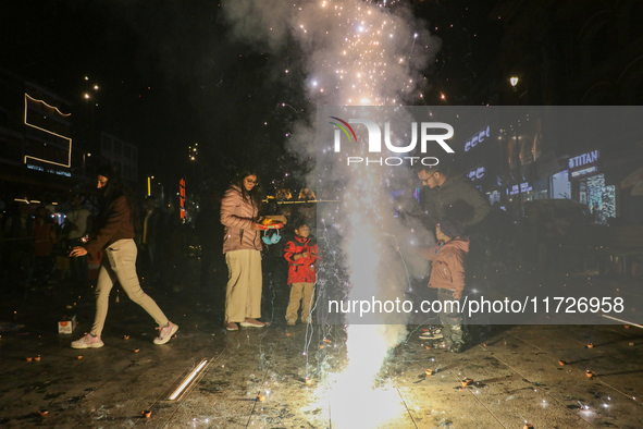 Tourists burst crackers on the day of Diwali in Srinagar, Indian Administered Kashmir, on October 31, 2024. 