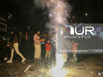 Tourists burst crackers on the day of Diwali in Srinagar, Indian Administered Kashmir, on October 31, 2024. (