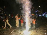 Tourists burst crackers on the day of Diwali in Srinagar, Indian Administered Kashmir, on October 31, 2024. (