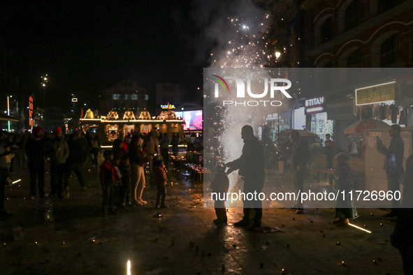 Tourists burst crackers on the day of Diwali in Srinagar, Indian Administered Kashmir, on October 31, 2024. 