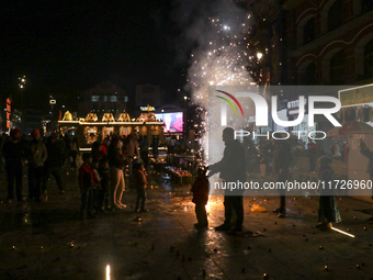 Tourists burst crackers on the day of Diwali in Srinagar, Indian Administered Kashmir, on October 31, 2024. (