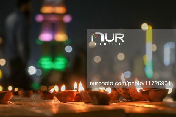 Tourists light candles on the day of Diwali in Srinagar, Indian Administered Kashmir, on October 31, 2024. 