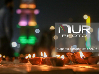 Tourists light candles on the day of Diwali in Srinagar, Indian Administered Kashmir, on October 31, 2024. (