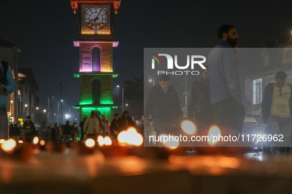 Tourists light candles on the day of Diwali in Srinagar, Indian Administered Kashmir, on October 31, 2024. 