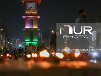 Tourists light candles on the day of Diwali in Srinagar, Indian Administered Kashmir, on October 31, 2024. (