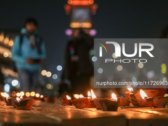 Tourists light candles on the day of Diwali in Srinagar, Indian Administered Kashmir, on October 31, 2024. (