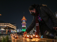 Tourists light candles on the day of Diwali in Srinagar, Indian Administered Kashmir, on October 31, 2024. (