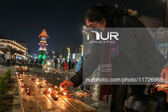 Tourists light candles on the day of Diwali in Srinagar, Indian Administered Kashmir, on October 31, 2024. 