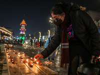 Tourists light candles on the day of Diwali in Srinagar, Indian Administered Kashmir, on October 31, 2024. (