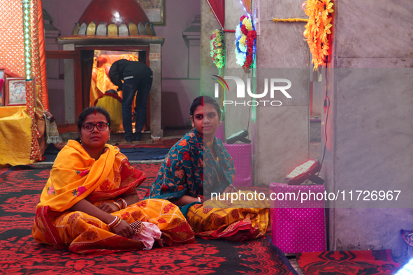 Non-local Hindus sit inside a temple on the day of Diwali in Srinagar, Indian Administered Kashmir, on October 31, 2024. 