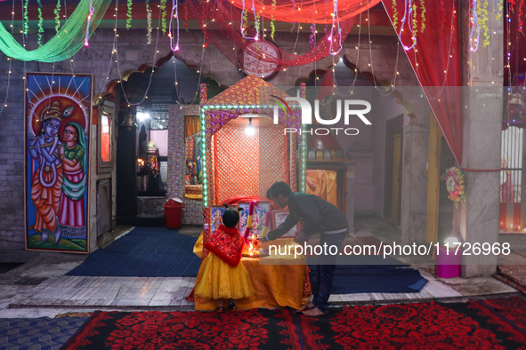 Non-local Hindus sit inside a temple on the day of Diwali in Srinagar, Indian Administered Kashmir, on October 31, 2024. 