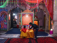 Non-local Hindus sit inside a temple on the day of Diwali in Srinagar, Indian Administered Kashmir, on October 31, 2024. (