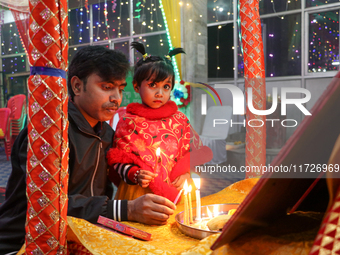 Non-local Hindus light candles on the day of Diwali in Srinagar, Indian Administered Kashmir, on October 31, 2024. (