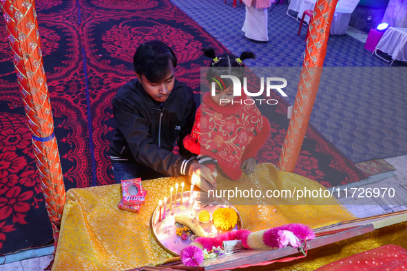 Non-local Hindus light candles on the day of Diwali in Srinagar, Indian Administered Kashmir, on October 31, 2024. 