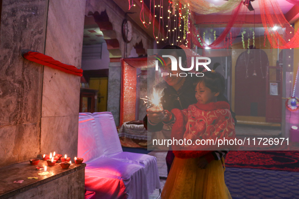 Non-local Hindus light firecrackers on the day of Diwali in Srinagar, Indian Administered Kashmir, on October 31, 2024. 